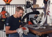 Kenny Lovell, a member of the Craig Interagency Hotshots, cleans a chainsaw Tuesday at the Hotshots’ station in Craig. Lovell, originally from Billings, Mont., is a four-year veteran firefighter who has spent two years with the Craig Hotshots.