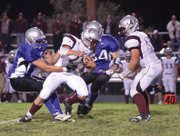Senior CJ Walt sacks the Palisade quarterback for a loss during the fourth quarter of the homecoming game Friday at the Proving Grounds. The MCHS defense only allowed eight points in the first half, but gave up 28 in the final 24 minutes.