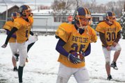 Junior Daniel Wille, center, is pictured here during practice Wednesday at the Little Snake River Valley School’s practice field in Baggs, Wyo. Wille and the rest of the Rattlers will look to finish their undefeated season at the 6-Man Wyoming State Championship game Friday in Laramie.