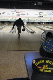 U.S. Army veteran Archie Albaugh, who served in Vietnam from 1969 to 1970, rolls the ball at Thunder Rolls Bowling Center in Craig. Thunder Rolls offered free bowling to veterans from 1 to 5 p.m. Saturday.