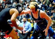 Moffat County High School’s Charlie Griffiths looks for a way to take down Rocky Mountain’s Derick Padilla in their match for third place. Padilla held off several last-second attacks from Griffiths for a one-point win in the match.