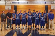 The Moffat County varsity basketball team is, back row, from left, head coach David Bradshaw, coach John Haddan, Bobby Kyle, Angelo Raftopoulos, Colby Haddan, Jacob Scroggs, Andrew Browning, Tyler Hildebradt, Chet Harvey, scout Bill Lawrence and manager Robert Razanno. Shown in the front row, from left, is Dylon Camilletti, Zach Raftopoulos, Taft Cleverly, Paul Laliberte, and Keenan Bradshaw.