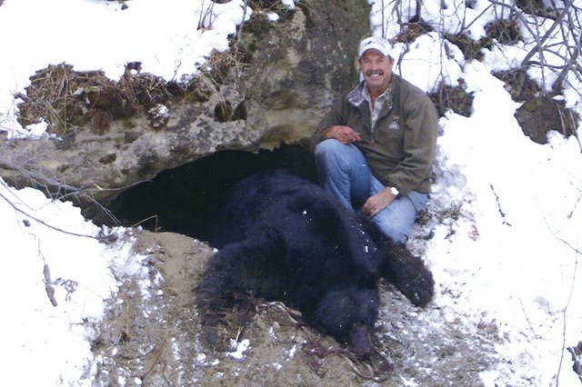 Craig resident Richard Kendall poses with the 703-pound black bear he shot in its cave in late November 2010. Kendall’s kill prompted the Colorado Division of Wildlife to draft regulations to prohibit the hunting, taking or harassment of bears in dens. Kendall was also fined by the DOW for using artificial light during his hunt of the bear.