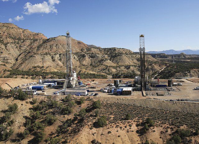 Shown here are natural gas well pads drilled below the rim of the Roan Plateau between Parachute and Rifle. Congressman Scott Tipton recently announced his intention to introduce legislation to free up and redistribute surplus royalty money collected from oil and gas drilling near the Roan Plateau previously designated as Naval Oil Shale reserve. Although Tipton has not yet introduced the legislation, dividing up the $50 million surplus among the federal government and four Northwest Colorado counties could land Moffat County up to $2.5 million.