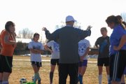 Harry Tripp, middle, the Moffat County High School girls varsity soccer coach, talks to his team March 15 at Woodbury Sports Complex. Tripp is entering his second season as head coach and said he hopes to improve on last year’s school record five wins.