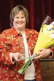 Moffat County resident Lorrae Moon stands Wednesday in the Moffat County Pavilion after being recognized as Moffat County United Way’s 2010 Volunteer of the Year. Moon, who drives a school bus in the mornings, was recognized for her volunteer work with various agricultural organizations in the area, including 4-H and the Yampa Valley Hens and Chicks.
