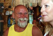 Danny Griffith, owner of J.W. Snack’s Bar & Grill, laughs Thursday after receiving the Craig Chamber of Commerce’s first Chamber Select award. Christina Oxley, executive director of the Chamber, smiles at right.