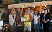 Teri, left, and Danny Griffith, owners of J.W. Snack’s Bar & Grill, middle, pose Thursday with Craig Chamber of Commerce Board members after receiving the first Chamber Select award. Pictured, from left, are Don Jones, Executive Director Christina Oxley, Jeremy Mattingley, Teri Griffith, Danny Griffith, Jeff Smith, Gail Severson, Missy Bonaker and Renee Campbell.