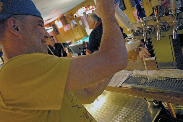 Brian Garcia, a bartender at Popular Bar, 24 W. Victory Way, prepares drinks for thirsty customers. Craig Daily Press readers voted Popular Bar as the best bar in the 2011 Best of Moffat County contest. Garcia said the bar is a fun watering hole because customers are always treated with respect and people feel comfortable. “It’s a clean, safe place,” Gacia said. “There are no fights, no drama.” Dena Garcia, of Craig, has owned the bar for 28 years.