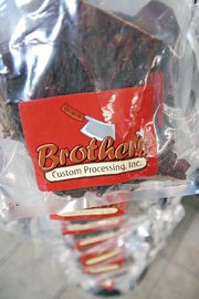 Award-winning jerky hangs from a rack within Brother’s Custom Processing, Inc. in Craig. Earlier this month, Brother’s jerky won reserve grand champion at the American Cured Meat Championships in Reno, Nev.