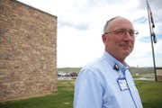 George Rohrich, chief executive officer of The Memorial Hospital in Craig, stands Wednesday outside the main entrance to the hospital. Rohrich began his tenure in 2006. Since then, the hospital has grown in size in three ways: square footage, employees and annual net revenue.