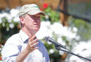 Gov. John Hickenlooper speaks Friday afternoon at Yampa Valley Feeds in Hayden. The governor appeared to present his plans for economic development. The event also featured presentations by regional officials and business owners. One of the featured businesses was Yampa Geo in Craig. Hickenlooper is pictured above wearing a hat from the business.