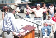 Gov. John Hickenlooper fields a comment Friday from Craig resident Matt Winey at Yampa Valley Feeds in Hayden. During a question-and-answer session, discussion turned to the coal industry and climate change.
