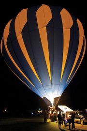 A hot air balloon is illuminated in the night sky during Saturday’s balloon glow as part of the Moffat County Hot Air Balloon Festival.