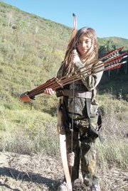 Tiana Nichols, 8, stands with her archery gear during the 2010 archery elk season in Moffat County. Tiana is too young to purchase an elk tag, but she accompanies her father on nearly all of his hunts. She said she can’t wait until she’s 12, so she can harvest her first elk.