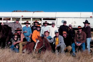The Lawton family, who live in Craig and Grand Junction, and their families pose on Indian Run in Northwest Colorado. The Lawtons have had friends come from Arkansas and Virginia to hunt for more than 20 years.