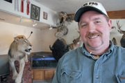 Craig taxidermist Scott Moore stands in June next to the prize-winning piece “Can’t Kill the King,” which he created with taxidermist Leland Reinier. The two men won first place for collective artist at the Colorado State Taxidermy Competition in June in Salida. The piece, which features an African lion, is on display at Moore’s business, Mountain Man Taxidermy in Craig.
