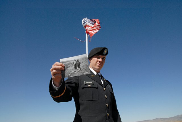 Don Penner holds a photo taken of himself and Casey Greene during a hunting trip in October 2002 when they were 13 years old. Greene, a specialist in the U.S. Army Rangers, Second Battalion, 75th Ranger Regiment, was wounded in Wardak Province in Afghanistan on Saturday morning, local time. Greene and Penner, both 2007 Moffat County High School graduates, have been friends since they were 7.