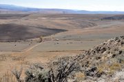 The house where Mary Dillon lived with her daughter and son-in-law, Adaline and Samuel H. Mosier, is pictured here as seen from the hill where Dillon was buried in January 1915. Samuel Mosier assumed the title of Moffat County Sheriff the same year Dillon died.