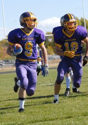 Conner Lee, a Little Snake River Valley School junior, runs down the sideline Friday during a punt return against Farson-Eden High School in Baggs, Wyo. Lee returned a punt and a kickoff for a touchdown and added a receiving touchdown to help lead the Rattlers to a 63-30 victory.