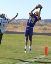 Rex Stanley, a Little Snake River Valley School senior, brings down a pass Friday against Farson-Eden High School in Baggs, Wyo. The Rattlers finished the regular season 8-0 and will host a first-round playoff game next week in Baggs.