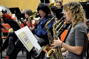 Eryn Leonard, foreground, a Moffat County High School junior, warms up in John Bolton’s band class Tuesday morning at the high school. Leonard is one of 11 MCHS band students selected to participate in the Northwest Colorado District Eight Honor Band on Friday and Saturday in Aspen.
