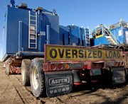 Generator houses from Rig 111 rest on truck trailers at the corner of Ranney and First streets in Craig. The rig finished its drilling operations on Harper Hill near Hamilton this week and is being transferred to Casper, Wyo.