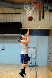 Annie Sadvar, a Moffat County High School senior, goes up for a lay-up during practice Nov. 9 at MCHS. After the team implemented a new offense last season, Sadvar said the outside shot is going to be the Bulldogs’ strong point this season on offense.