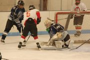 Moffat County Bulldogs goalie Trent Parrott dives on a puck during the Moffat County Bulldogs club hockey team’s Saturday game against the Crested Butte Wolf Pack. Parrott had 115 saves in the club hockey team’s three losses over the weekend.