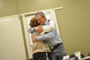 Don Myers, newly elected chairman of The Memorial Hospital Board, gives a hug to outgoing board member Missy Bonaker at her last board meeting Thursday night. “I think she was a valuable member of the hospital board, and we’re going to miss her,” he said of Bonaker before the meeting.