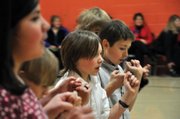 Lane Ferguson, center, a Sunset Elementary School fifth-grader, dances with a group of his classmates during a program Friday morning at the school. Sunset Elementary students in fifth- through first-grades danced for an audience of parents in a series of performances Friday.