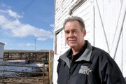 Gary Nichols pauses in front of one of Moffat County’s oldest structures, the Murphy Family Barn on Ranney Street. Current owner Dave Seely believes the barn was built in 1895. Nichols and Seely go back more than 30 years when the two worked together at the Seely family’s cattle ranch in White River National Forest.