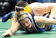 Moffat County junior Garrett Stewart wrestles Josh Donkle of Windsor on Thursday during the first round of the Class 4A state wrestling tournament in Denver.