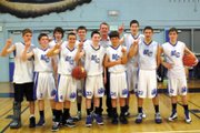 The Moffat County boys eighth-grade youth basketball team celebrates after winning the Yampa Valley Classic tournament Sunday at Moffat County High School. Head coach Chad Elliott said even after an early loss, his players never gave up and fought their way back into the championship game.