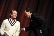 Skooter Byrnes, a Moffat County High School junior portraying playwright Alex Dennison, leans in to speak to sophomore Derek Maiolo, portraying David Mathews, during a dress rehearsal Monday for “Rehearsal for Murder.” The play features a relatively small cast of 15 actors and is set in late 1930s New York City.
