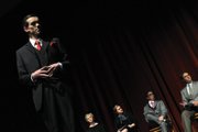 Skooter Byrnes, playing playwright Alex Dennison, stands silhouetted in front of other actors on the stage Monday night at the Moffat County High School auditorium. “Rehearsal for Murder” gave Heather Dahlberg, MCHS theater and choir teacher, a chance to work with a smaller group of committed and mature student actors, she said.