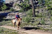 Craig resident Ken Wolgram gallops atop his horse, Awesomes Fire N Ice, during a North American Trail Ride Conference competition in Evergreen. The team participated in 12 NATRC events in 2011, and for the first time in the organization’s history, took home all four national trophies.