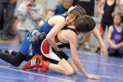 Drew Rothermund, 12, tries to turn his opponent during the sixth annual Craig Bad Dogs Wrestling Classic tournament Saturday at Moffat County High School. More than 400 youth wrestlers from four different states competed in the tournament.