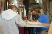 Potential employees fill out applications Friday at Colorado Northwestern Community College during the 2012 Moffat County Job Fair, sponsored by CNCC, the Colorado Workforce Center and the Craig Daily Press. Fair organizer and Craig Daily Press advertising manager Bonnie Stewart said organizers hope to host the fair annually.