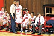Adrian Hayes, the Colorado Northwestern Community College men’s basketball head coach, talks with one of his players during a game this season. The Spartans had 10 freshmen suit up this season out of 13 players, but Hayes said the experience will benefit the team next year.