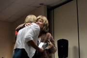 Corrie Ponikvar, right, Moffat County United Way director, hugs Amy Knights, former United Way board member, during an awards luncheon Wednesday to recognize donors to the organization’s 2012 campaign. Ponikvar presented Knights with a plaque in recognition of her service to the board.