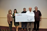 Xcel Energy representatives presented Moffat County United Way board members with a check for $36,113—which included employee donations and a company match— after an awards luncheon Wednesday at Holiday Inn of Craig. Pictured, from left, are United Way director Corrie Ponikvar, treasurer Donna Stover, Xcel station director Walt Wair, United Way Board President Joel Sheridan and Andy Mills, Xcel engineering and support manager.