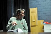 David Morris gives direction to an actor during a read-through of his play, “Taming the Wilderness, or the Founding of a Town,” on Monday night at Craig Middle School. He did some research through the Museum of Northwest Colorado on the people involved in Craig’s founding, he said. “From there, I left reality,” he said, laughing.