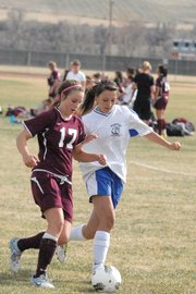 Brittany Walker, a Moffat County High School sophomore, steals the ball from a Palisade defender Tuesday at Woodbury Sports Complex.