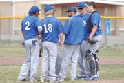 Coach Justin Folley and his Moffat County High School varsity baseball team confer on the pitcher’s mound Saturday afternoon during a doubleheader with Palisade. The team fell, 12-2 and 6-2, over the weekend.