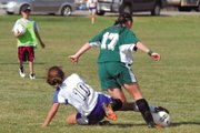 Moffat County High School senior Kelly Ciesco, left, steals the ball from a Delta player during the girls varsity soccer game Tuesday at Woodbury Sports Complex. The Bulldogs lost an aggressive game, 4-2.