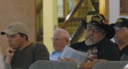 Guy Bradshaw, commander-elect of Veterans of Foreign Wars Post 4265, listens to a question posed by Craig City Council member Joe Bird Tuesday night. Bradshaw petitioned city council to consider reopening lease negotiations for Veterans Memorial Park.