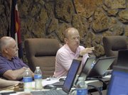 Craig City Council member Gene Bilodeau explains to Larry Neu, quartermaster of Veterans of Foreign Wars Post 4265, that he would entertain reopening lease negotiations only if the VFW would consider the city’s original lease terms.