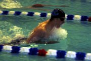 Moffat County High School junior Matt Hulstine comes up for air during the 100-meter breaststroke event of the Moffat County Invitational Friday afternoon at the Moffat County High School pool. Hulstine placed first in the event and second in the 200-meter individual medley.