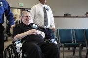 Frank Sonntag smiles as he is wheeled down the aisle during the renewal of his wedding vows Sunday at the Journey at First Baptist. He and his wife Barbara Jean were married Aug. 20, 1960, in Reno, Nev., and had never had a formal church wedding.